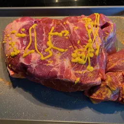 Add Mustard Binder to the Pork Shoulder